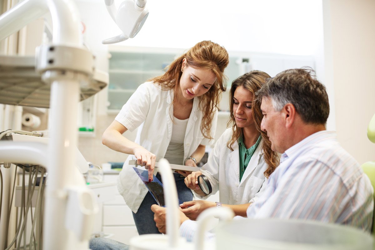 Lab technicians preparing dental varnish samples icon